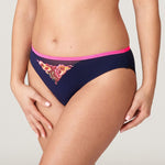 Side angle of model in Devdaha Rio Brief Velvet Blue from The Foundation, highlighting elastic trim and comfortable fit