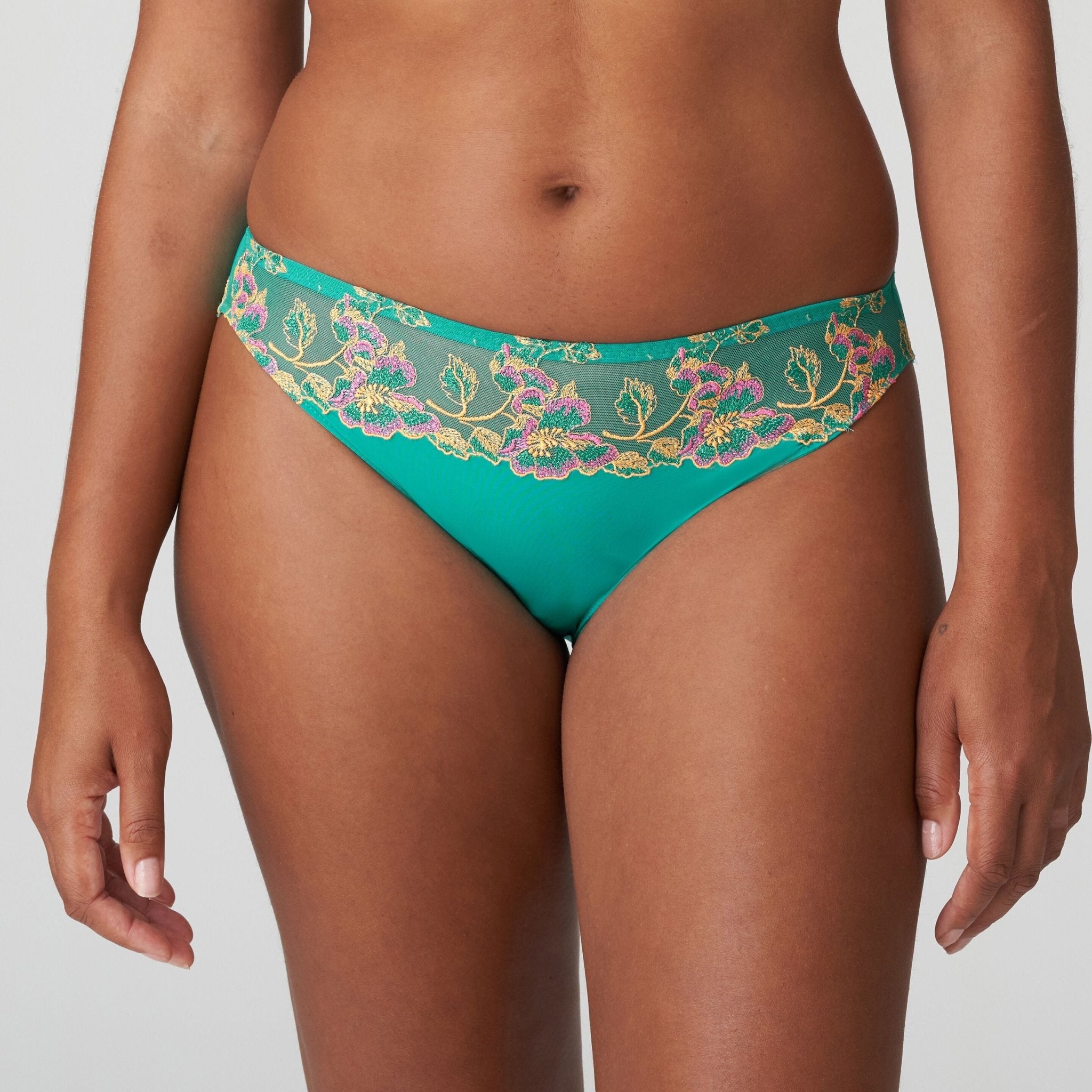 Front view of Lenca Rio Briefs Sunny Teal from The Foundation, showing vibrant green colour and detailed floral embroidery at the waist