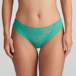 Model wearing the Melipha Thong in Vivid Green, showcasing flattering high-leg fit and soft lace finish.