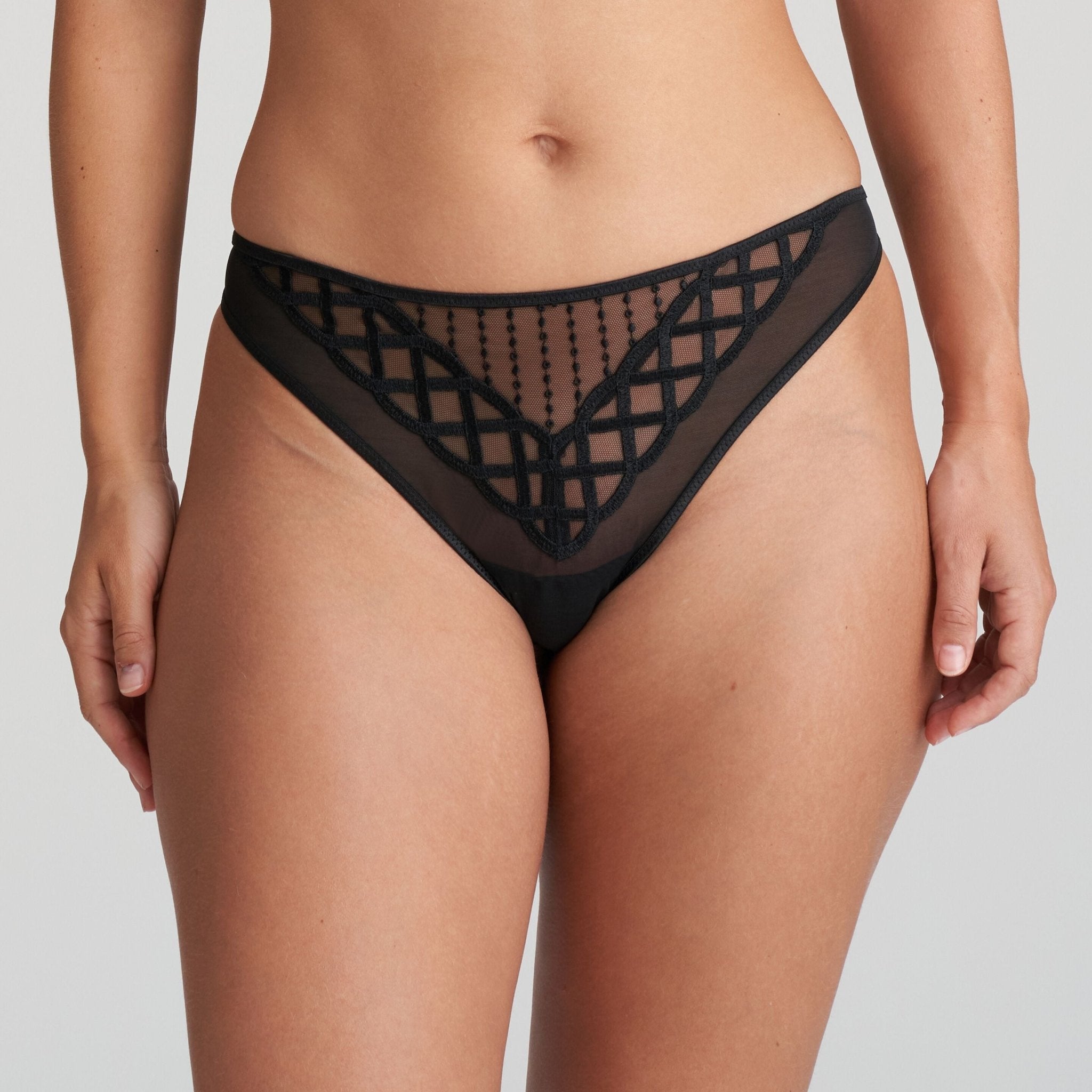 Front view of Jhana Thong Black from The Foundation, showing high-cut leg and striking geometric lace detail