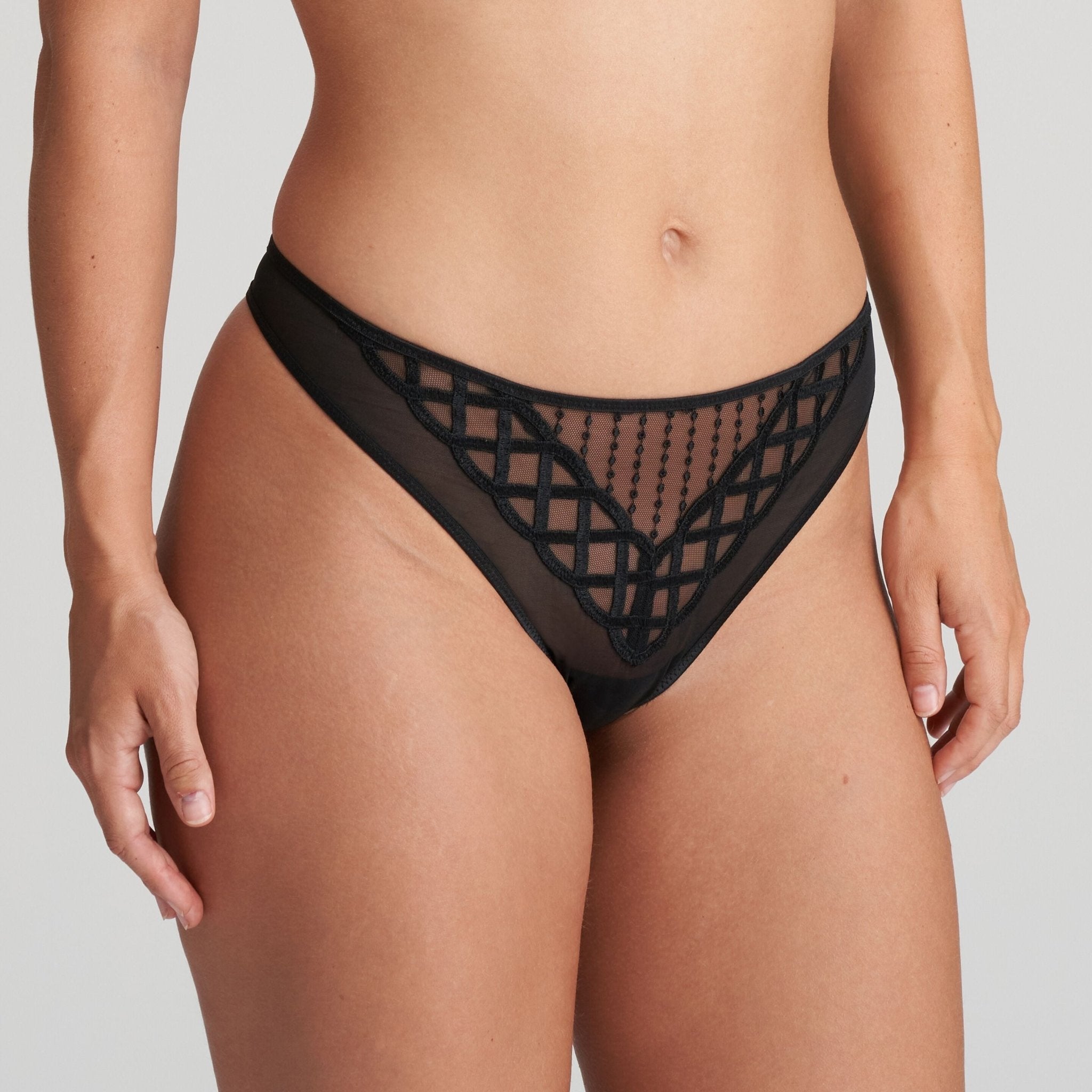 Model wearing Jhana Thong Black from The Foundation, highlighting flattering cut and elegant lace design on the front