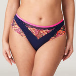 Devdaha Luxury Thong Brief by PrimaDonna – close-up of floral embroidery and neon pink waistband on velvet blue mesh.