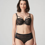 Model in PrimaDonna Sophora Full Cup Bra Black, three-quarter angle, focusing on cleavage straps and seamless finish, from The Foundation.