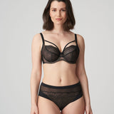 Model in PrimaDonna Sophora Full Cup Bra Black, three-quarter angle, focusing on cleavage straps and seamless finish, from The Foundation.