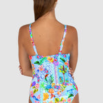 Woman wearing a colorful swimsuit with a white background back view Baku Sardinia Collection Ocean