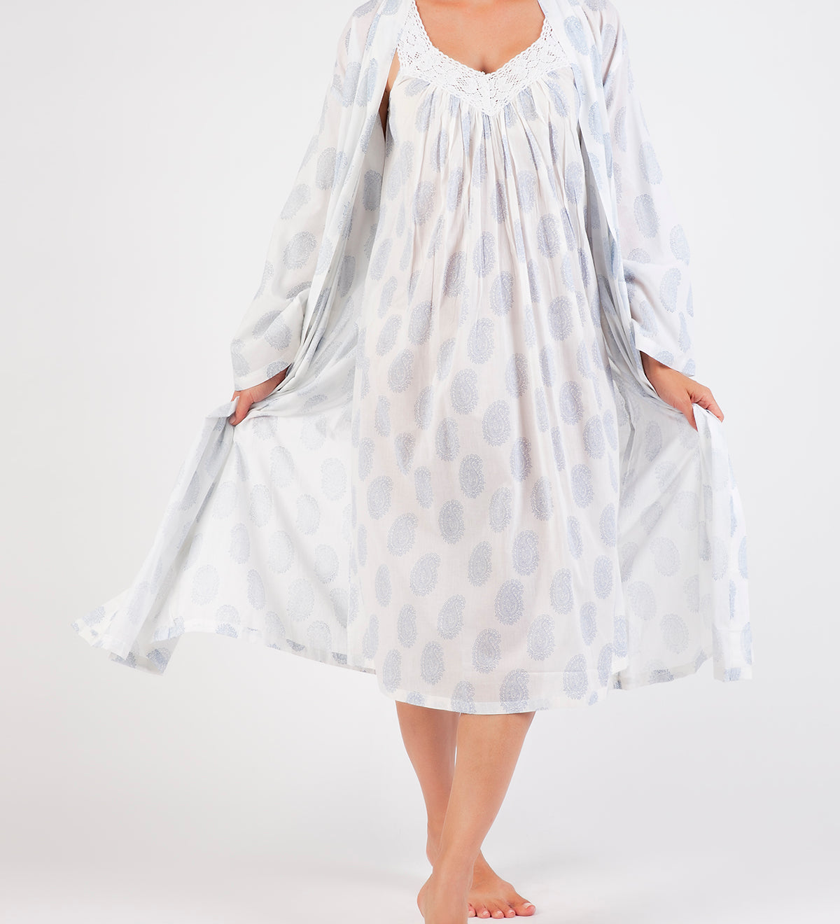 Model wearing Cotton Robe in white with blue paisley print, featuring a tie waist and airy cotton voile for breathable comfort.