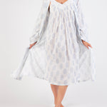 Model wearing Cotton Robe in white with blue paisley print, featuring a tie waist and airy cotton voile for breathable comfort.
