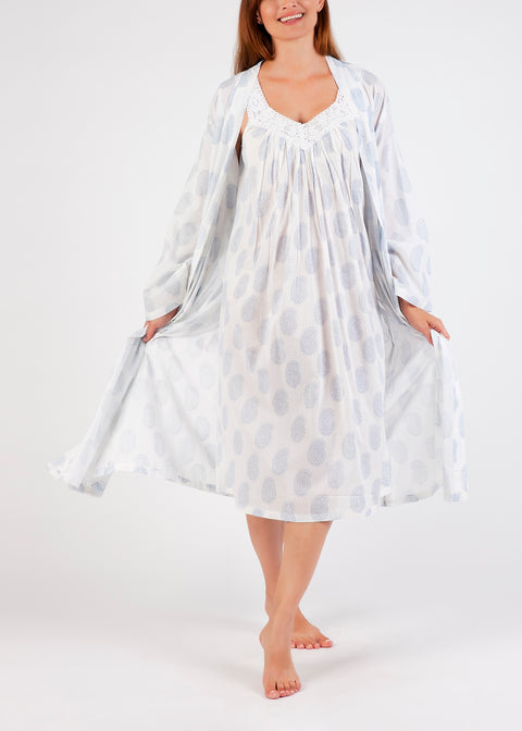 Model wearing Cotton Robe in white with blue paisley print, featuring a tie waist and airy cotton voile for breathable comfort.