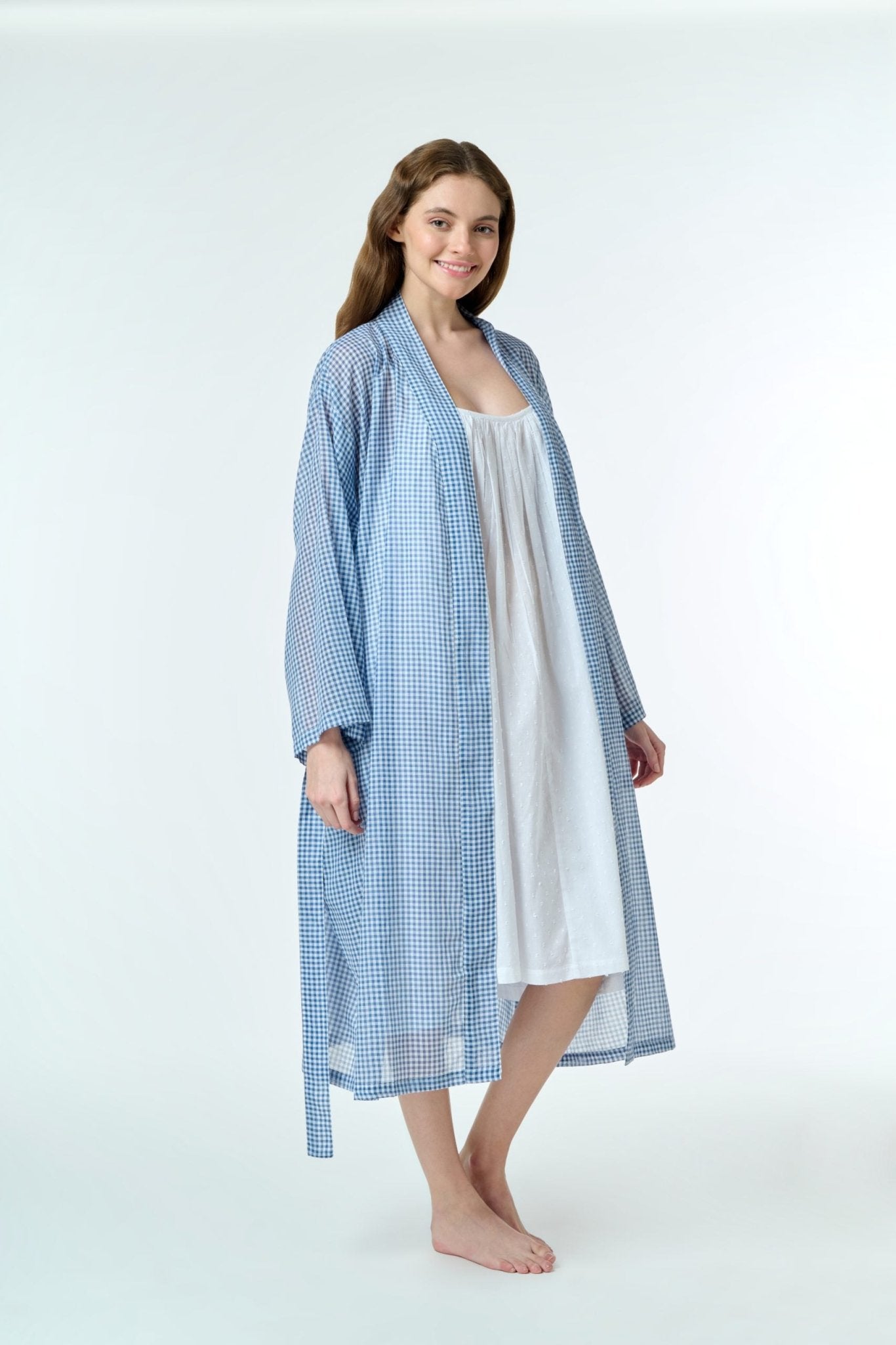 Side view of Hand Loomed Cotton Robe in navy gingham, styled as a breezy cover-up for sleepwear or everyday wear.