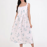 Model wearing Tucked Strappy Nightie Floral 3, showcasing light blue floral print and lace-trimmed square neckline.