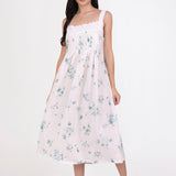 Model wearing Tucked Strappy Nightie Floral 3, showcasing light blue floral print and lace-trimmed square neckline.