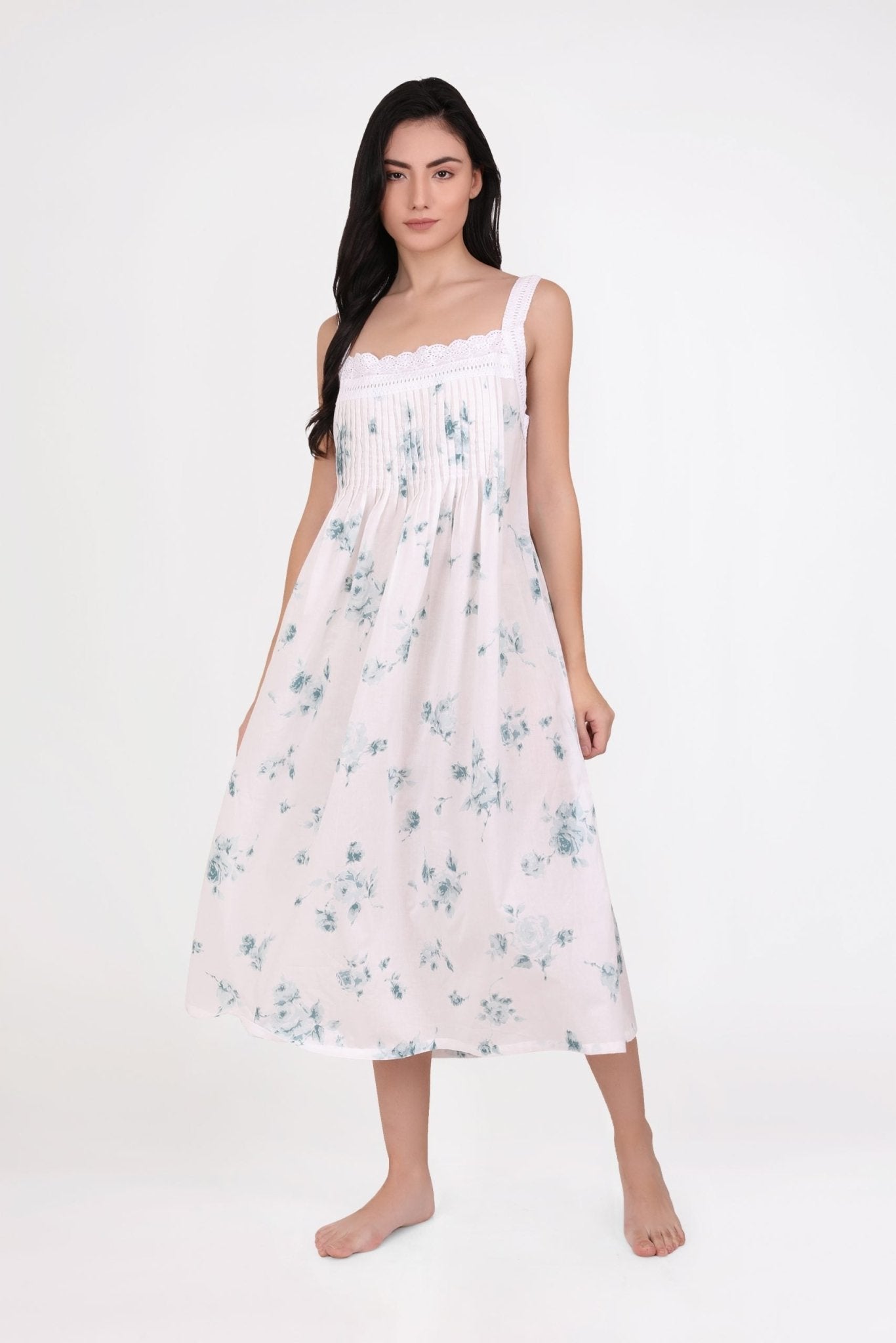Model wearing Tucked Strappy Nightie Floral 3, showcasing light blue floral print and lace-trimmed square neckline.