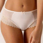 Close-up of intricate lace on the gold Empreinte Melody Brief, highlighting the quality craftsmanship stocked by The Foundation.