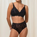 Matching Triumph Amourette Charm bra and brief set in black lace, styled together.