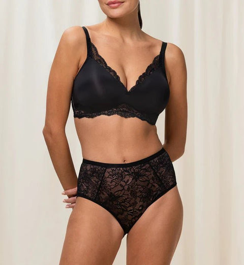 Matching Triumph Amourette Charm bra and brief set in black lace, styled together.