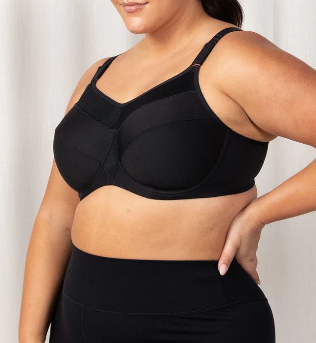 Side profile of Triaction Ultra Sports Bra Black, highlighting double-layer cups and padded straps