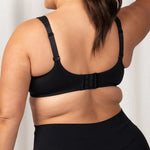 Back view of Triaction Ultra W Sports Bra in Black, featuring adjustable hook and eye closure