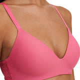 Close-up of the Pila Wirefree Bra in Love Pink/Peach showing plunge neckline and smooth cups – available at The Foundation.
