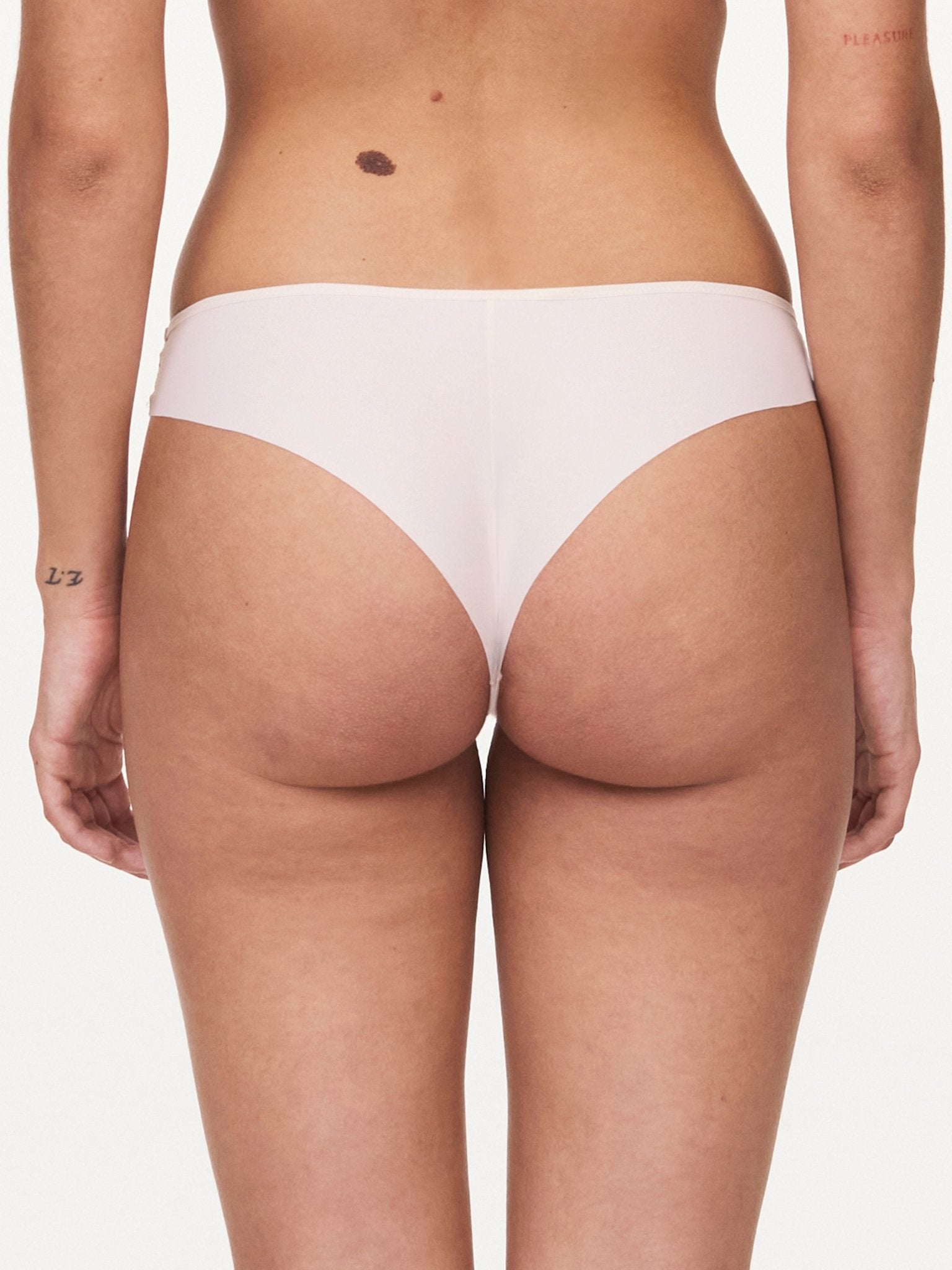 Back view of Pila Tanga Brief in Talc with ultra-flat finishes and soft knit fabric – part of The Foundation's collection.