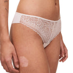 Side view of the Pila Tanga Brief in Talc, featuring sheer lace front and fishnet waistband – from The Foundation.
