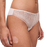 Side view of the Pila Tanga Brief in Talc, featuring sheer lace front and fishnet waistband – from The Foundation.