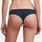 Back view of highlighting the soft, opaque knit fabric and thong silhouette designed for everyday comfort.