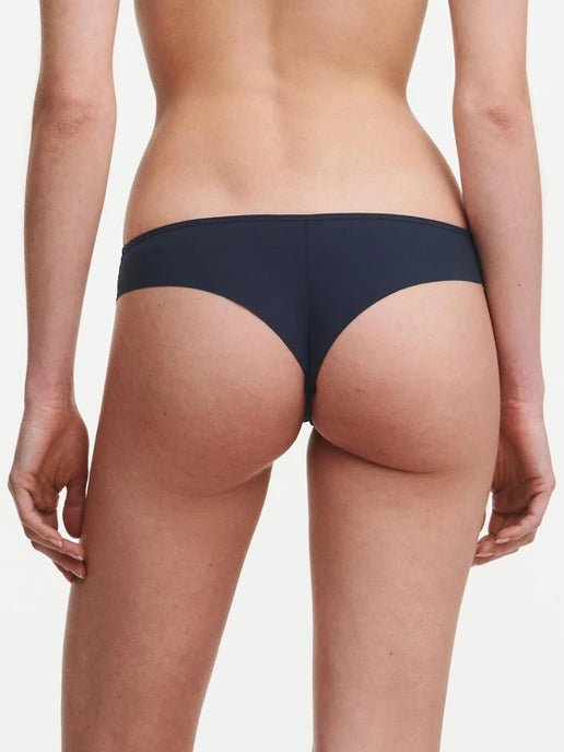 Back view of highlighting the soft, opaque knit fabric and thong silhouette designed for everyday comfort.