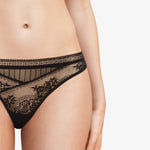 Close-up of Maddie Tanga Thong Brief in black with floral lace and striped tulle contrast panel.