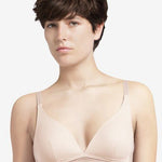 Model wearing the Manhattan Non Wire Triangle Bra in Talc with lightly padded cups and graphic tulle finish.