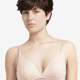 Model wearing the Manhattan Non Wire Triangle Bra in Talc with lightly padded cups and graphic tulle finish.