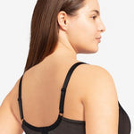 Model in Passionata Brooklyn Plunge T-Shirt Bra in Black from The Foundation, with low centre plunge, foam underwire cups, and smooth lace detail. back view