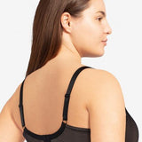 Model in Passionata Brooklyn Plunge T-Shirt Bra in Black from The Foundation, with low centre plunge, foam underwire cups, and smooth lace detail. back view