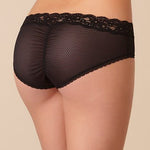 Model wearing Passionata Brooklyn Shorty Brief in Black from The Foundation, featuring lace-trimmed edges, sheer mesh back, and a medium-rise fit. back view