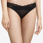 Model wearing Passionata Brooklyn Tanga Brief in Black from The Foundation, designed with sheer mesh, flat lace, and a seamless low-rise fit. front view