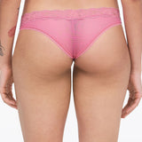 back view of Model wearing the Brooklyn Tanga Brief Gardenia from The Foundation – sheer mesh and seamless lace for a no-VPL finish.