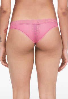 back view of Model wearing the Brooklyn Tanga Brief Gardenia from The Foundation – sheer mesh and seamless lace for a no-VPL finish.