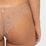 Back view of the Samanta Perla Thong in cappuccino, showing mesh rear and seamless finish, available at The Foundation.