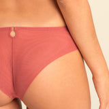 Back view of model wearing Perla Thong showcasing mesh rear and seamless cut.