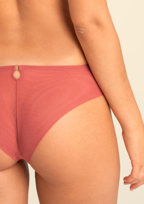 Back view of model wearing Perla Thong showcasing mesh rear and seamless cut.