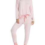 Model mid-step in cozy Papinelle loungewear, highlighting soft brushed jersey and relaxed jogger fit.