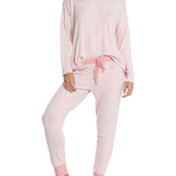 Model mid-step in cozy Papinelle loungewear, highlighting soft brushed jersey and relaxed jogger fit.