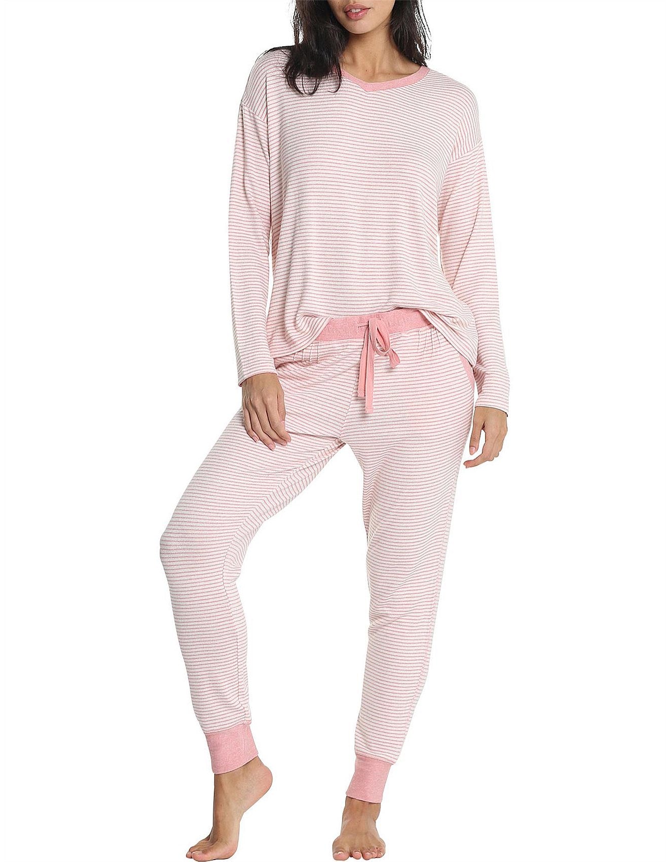 Model mid-step in cozy Papinelle loungewear, highlighting soft brushed jersey and relaxed jogger fit.