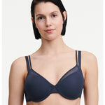 Model wearing the Pila Covering Spacer Bra in Sailing Blue, showcasing its smooth 3D cups and clean neckline for a t-shirt-ready finish.