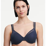 Model wearing the Pila Covering Spacer Bra in Sailing Blue, showcasing its smooth 3D cups and clean neckline for a t-shirt-ready finish.