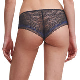 Model showcasing the back of the Pila Shorty Brief in Sailing Blue, featuring semi-sheer lace with a floral design for a chic, feminine touch.
