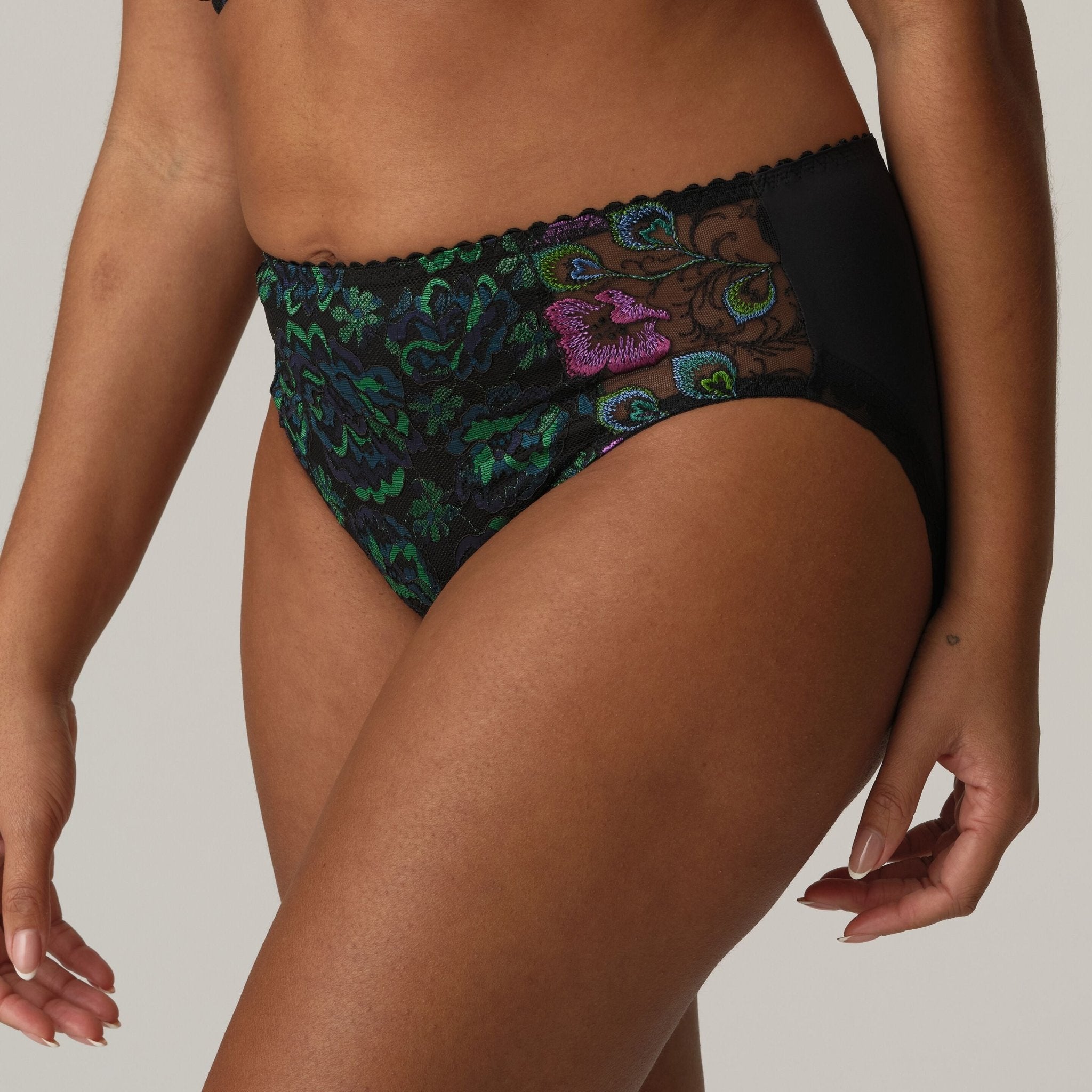 Side view of Prima Donna San Angel Full Brief Peacock Feather on model, highlighting full tummy coverage and luxe lace detail at The Foundation.