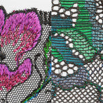 Zoomed embroidery of San Angel Peacock Feather plunge bra, highlighting intricate pink and teal feather threadwork, exclusive to The Foundation.
