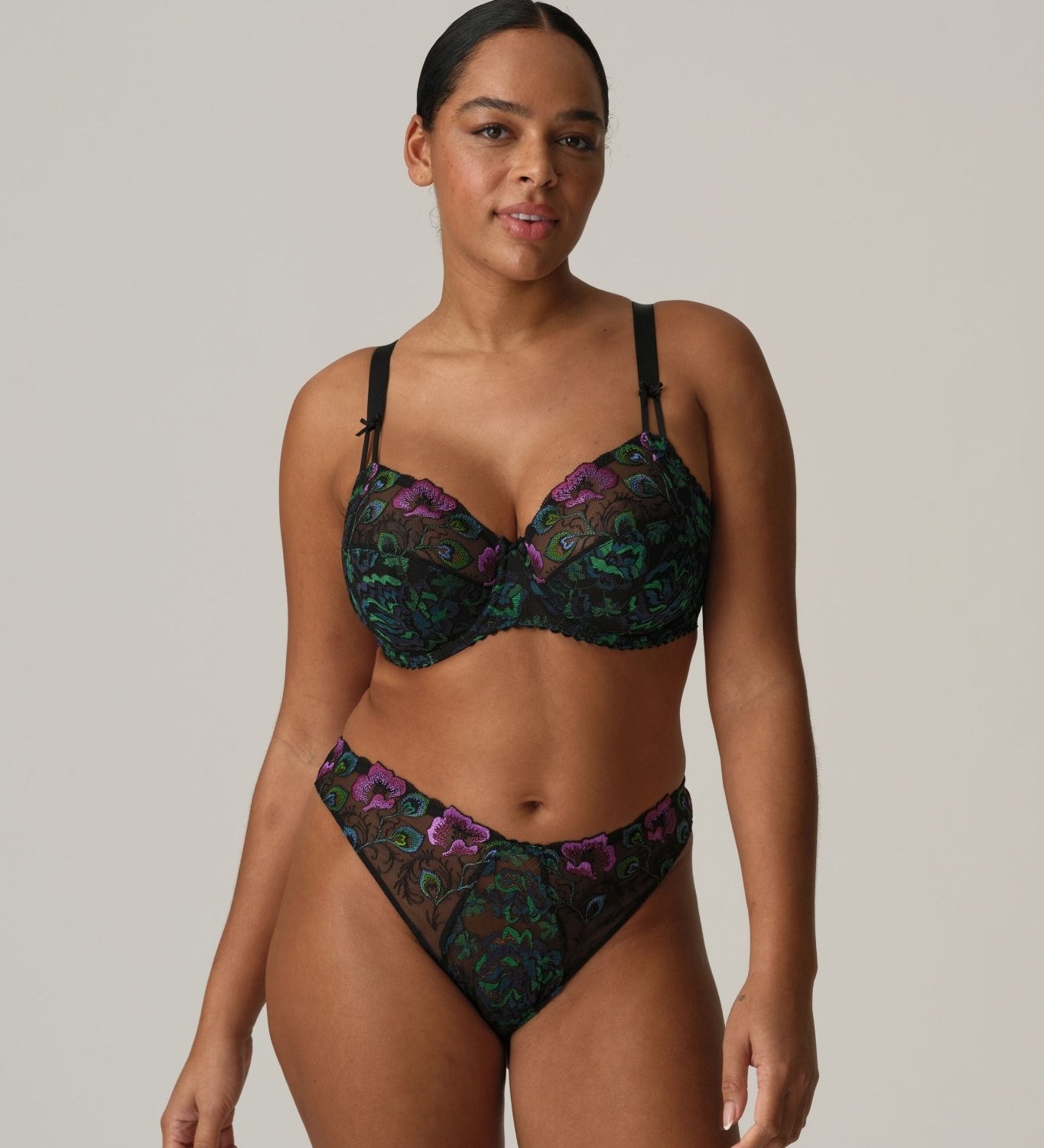 Model in San Angel Thong Brief Peacock Feather by Prima Donna, styled with matching bra, showing blue-green Italian lace at The Foundation.