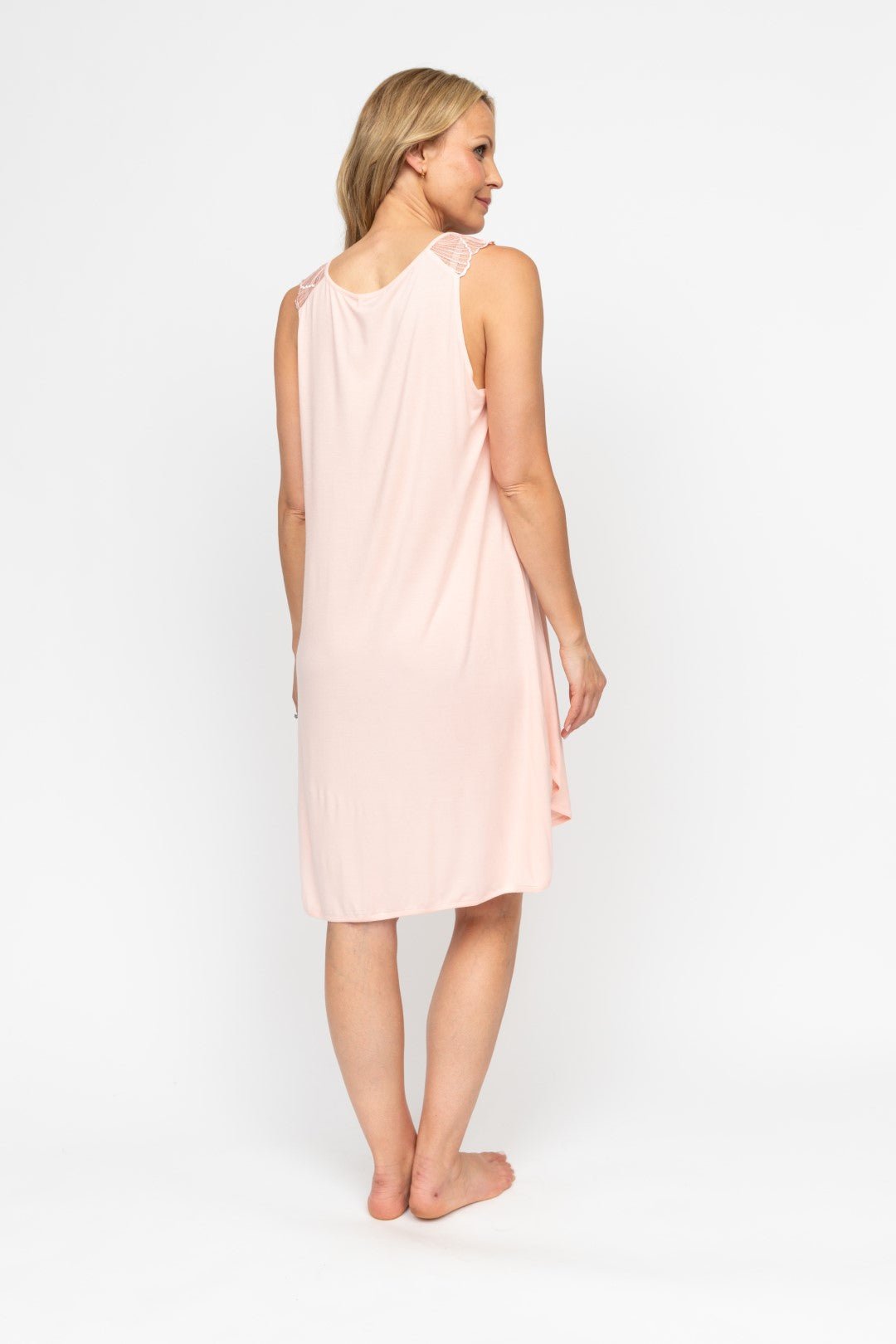 Back view of the Sally Lace-Detail Nightdress, highlighting its relaxed swing fit and gently shaped hem.
