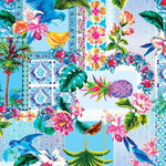 Colorful tropical pattern with birds, flowers, and leaves on a blue background